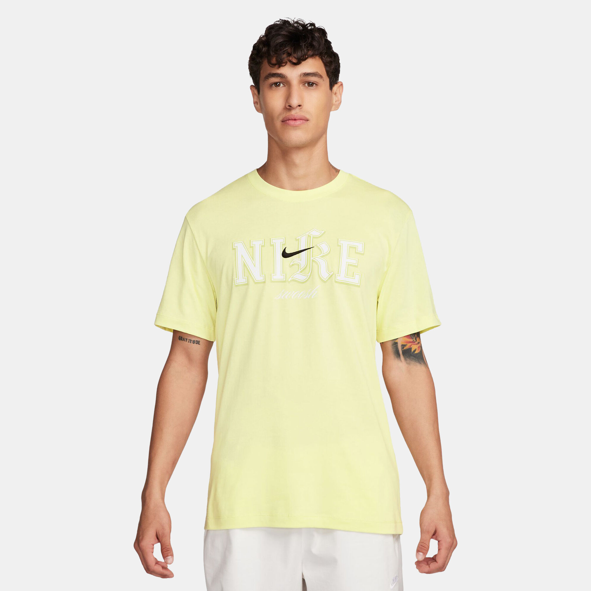 White and yellow nike shirt top