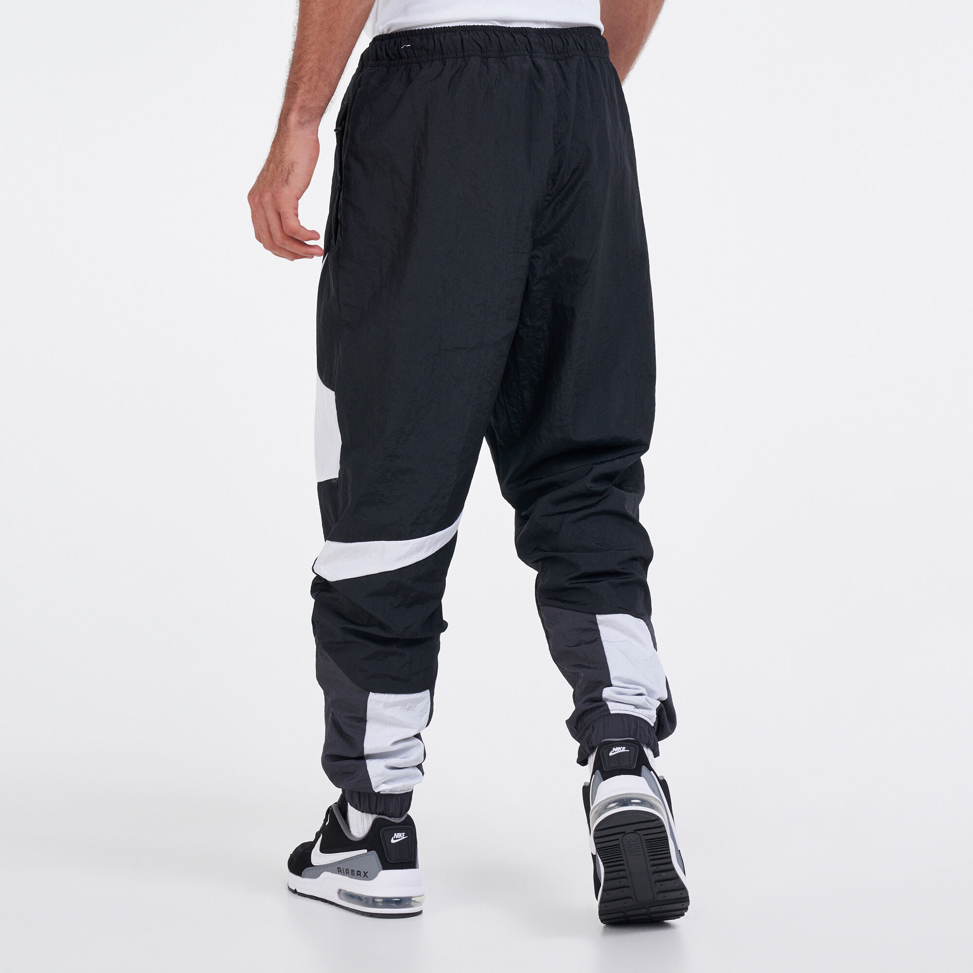 Buy Nike Men s Sportswear Swoosh Woven Lined Pants Black in KSA SSS