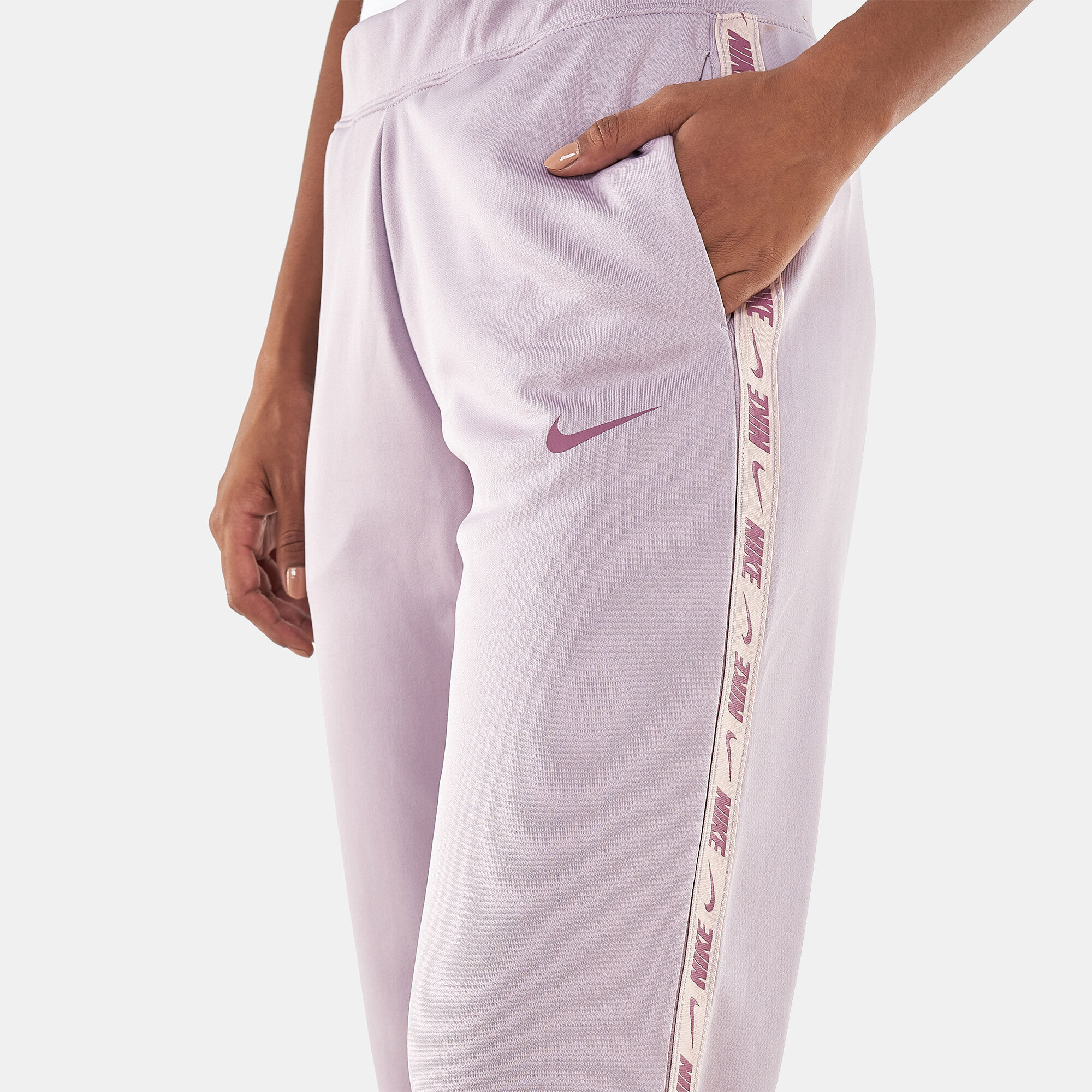 Buy Nike Women s Sportswear Logo Tape Sweatpants Purple in KSA SSS