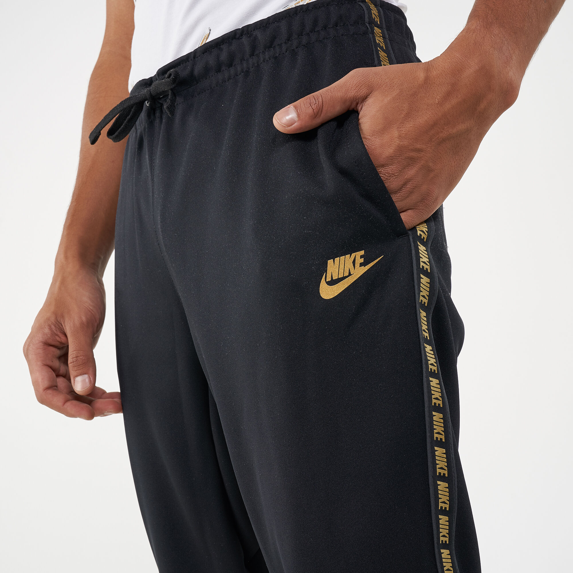 Nike taped poly pants black hotsell