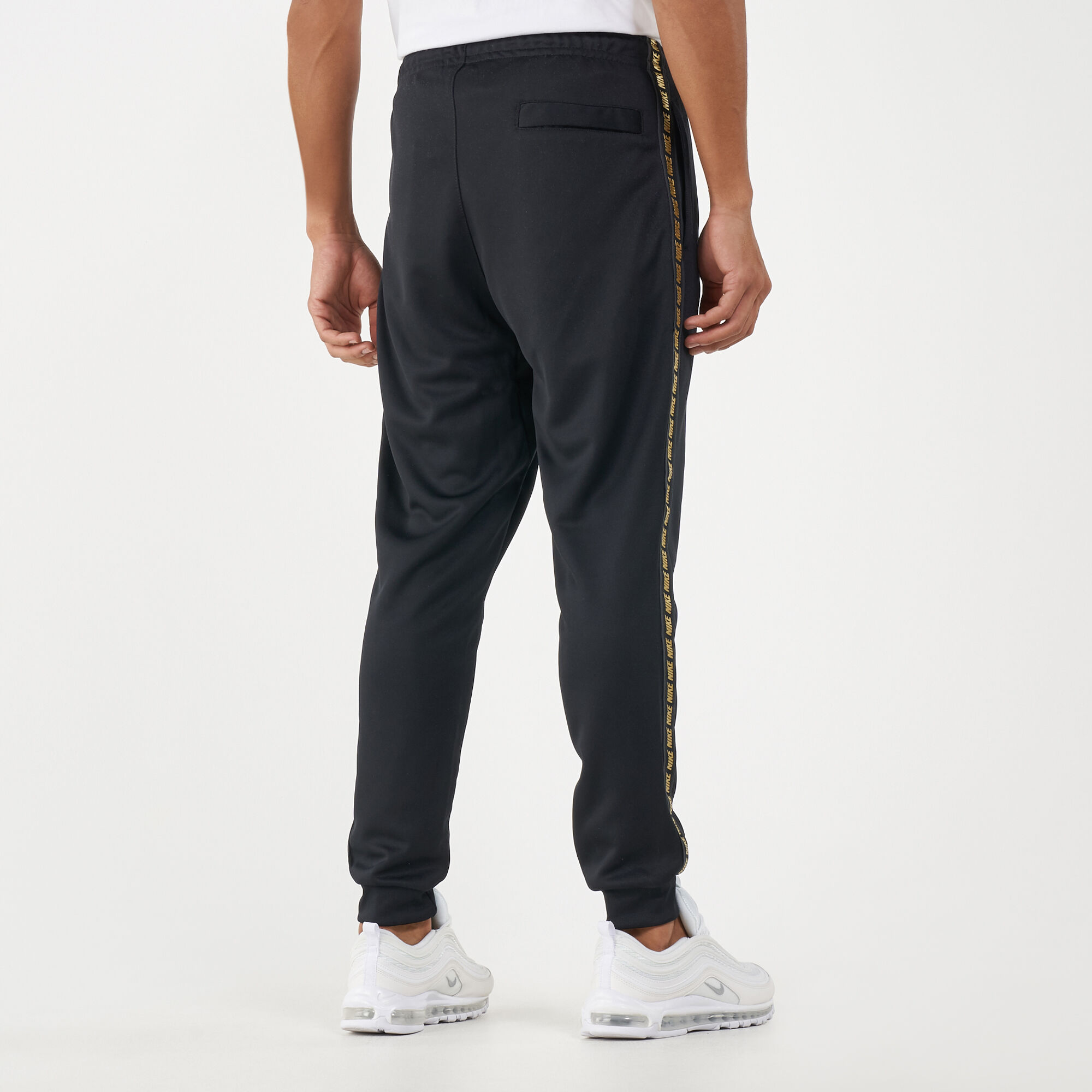 Nike tape poly store track pants gold