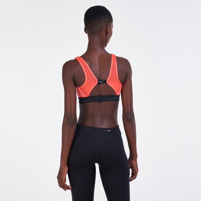 Buy Nike Women's Sport Distort Indy Plunge Sports Bra Orange in