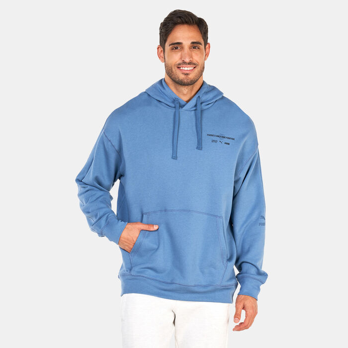 PUMA Men's Classics RE:ESCAPE Hoodie Green PUMA Men's Classics RE:ESCAPE Hoodie Green image number 0