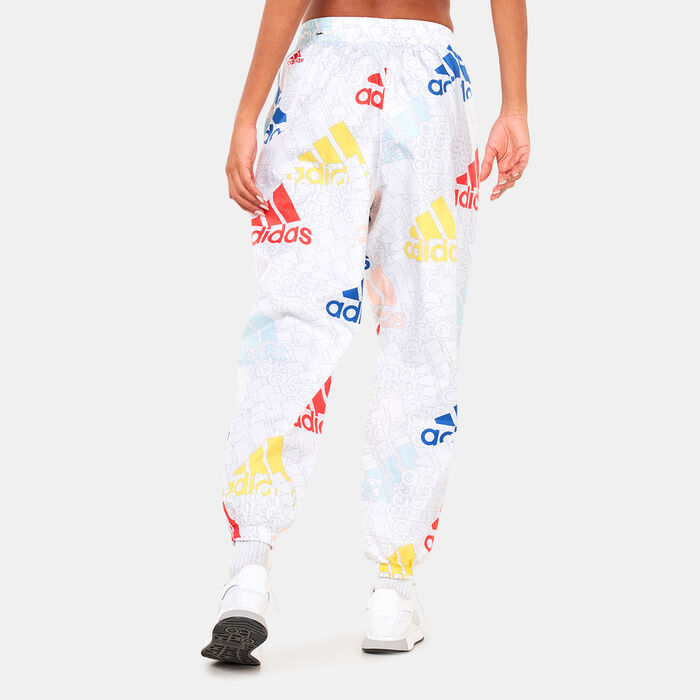 adidas Women's Essentials Multi-Coloured Logo Loose Fit Woven Pants White adidas Women's Essentials Multi-Coloured Logo Loose Fit Woven Pants White image number 1