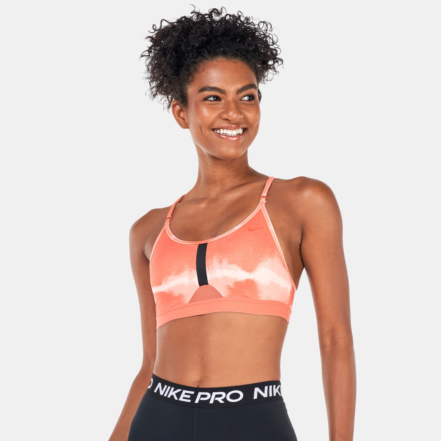 Buy Nike Women s Indy Dye Allover Print Sports Bra Orange in KSA SSS