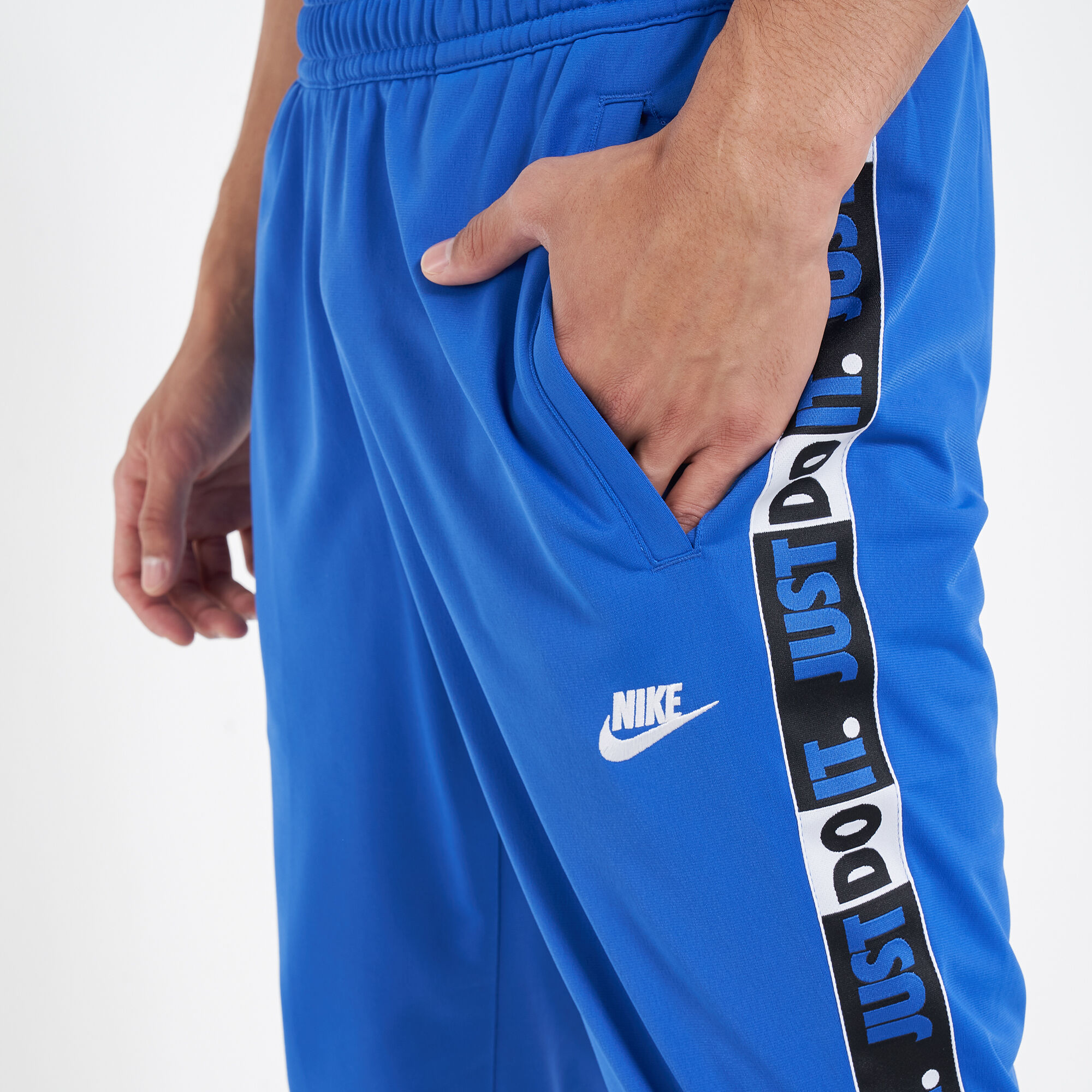nike swoosh tape track pants