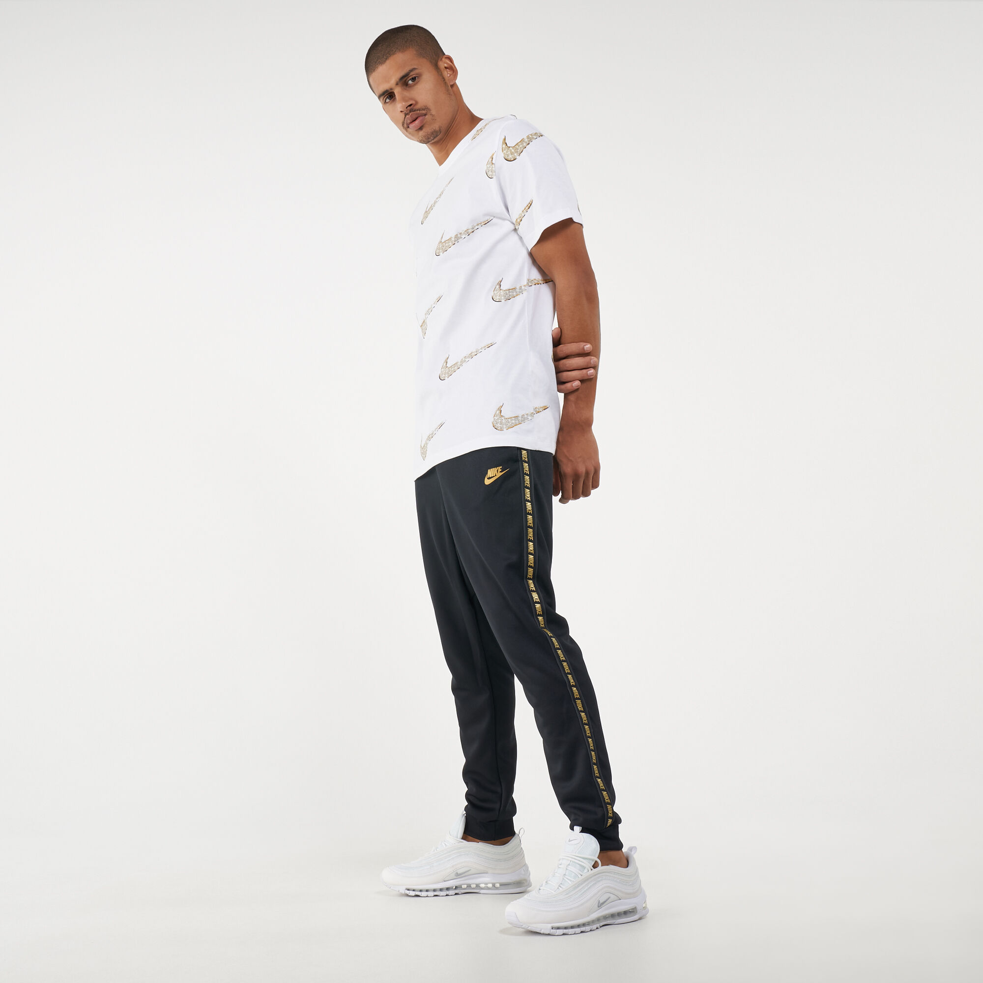 Nike tape poly store track pants gold