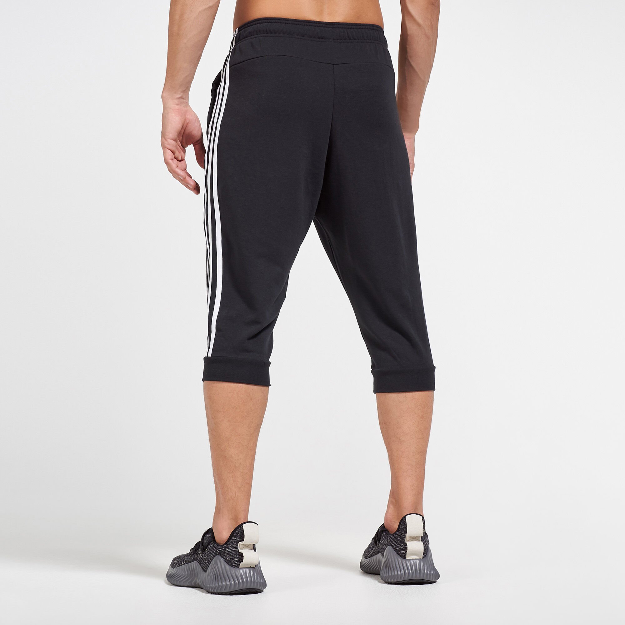 Buy adidas Men s Essentials 3 Stripes 3 4 Sweatpants Black in KSA SSS