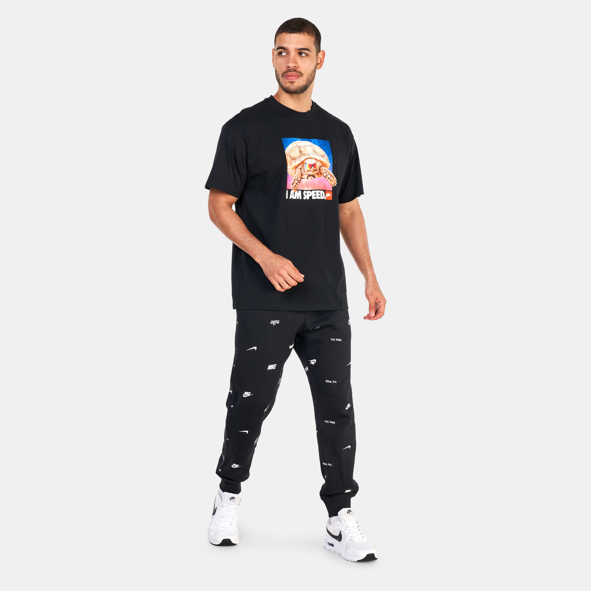 Nike joggers hotsell all over print