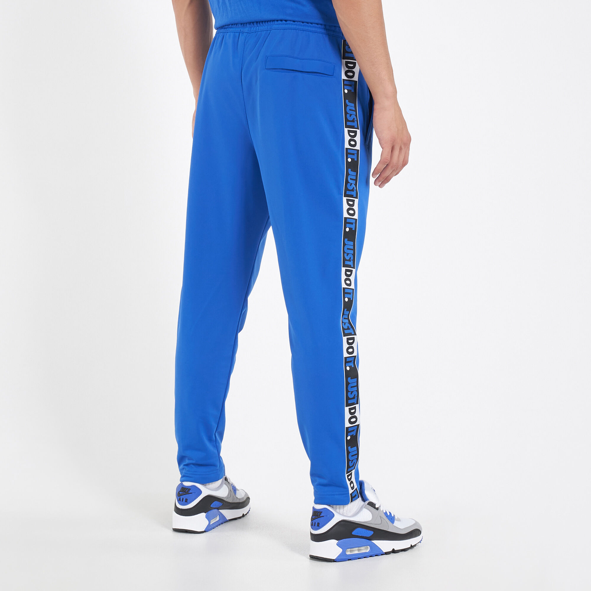 Nike sportswear hotsell taped pants