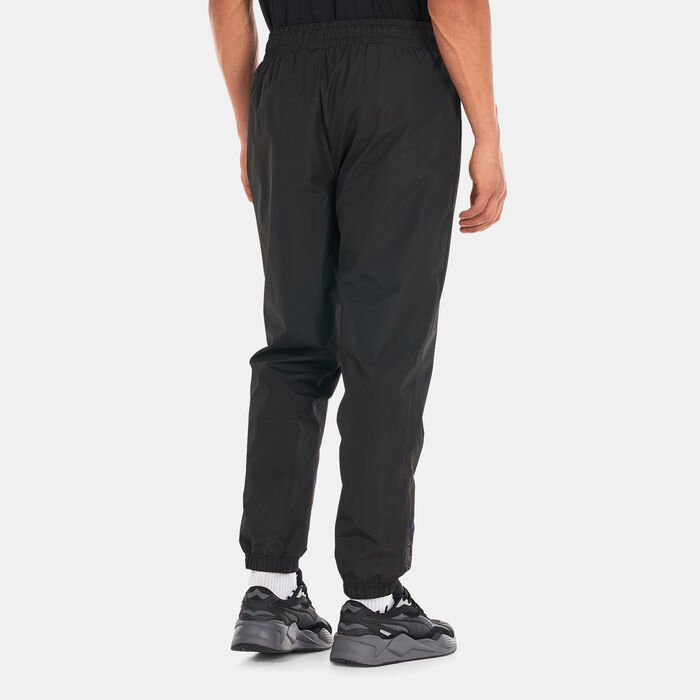 New Era Men's Los Angeles Lakers Allover Print Panel Track Pants Black New Era Men's Los Angeles Lakers Allover Print Panel Track Pants Black image number 1