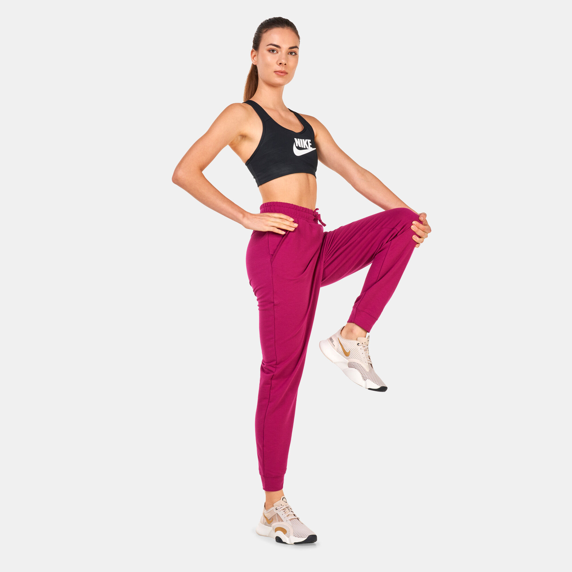 Buy Nike Women s Yoga Dri FIT 7 8 Fleece Joggers Purple in KSA SSS